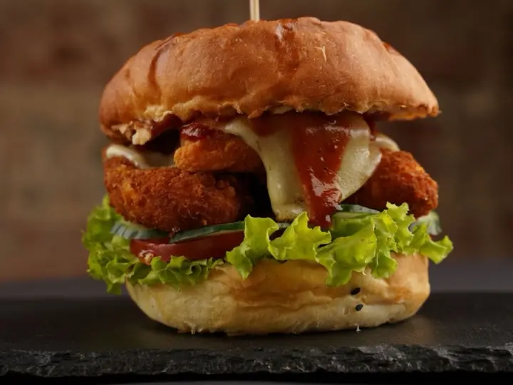 Fried chicken sandwich with a glossy honey glaze